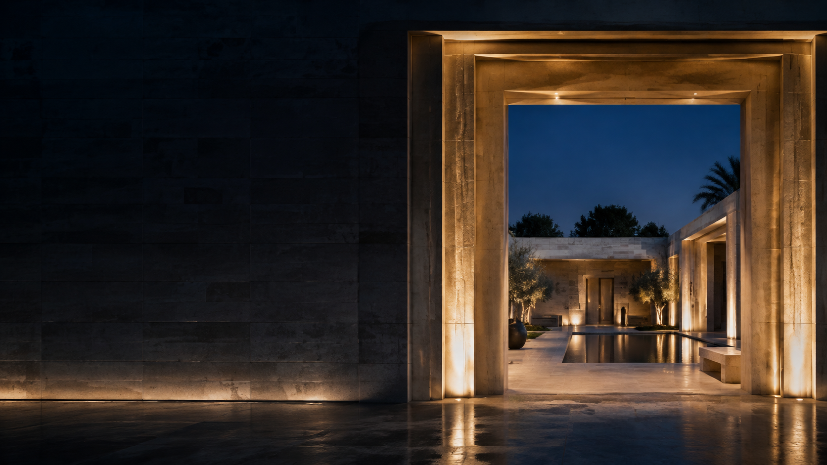 Architectural concept: a warmly lit stone gateway opening onto a courtyard and reflecting pool